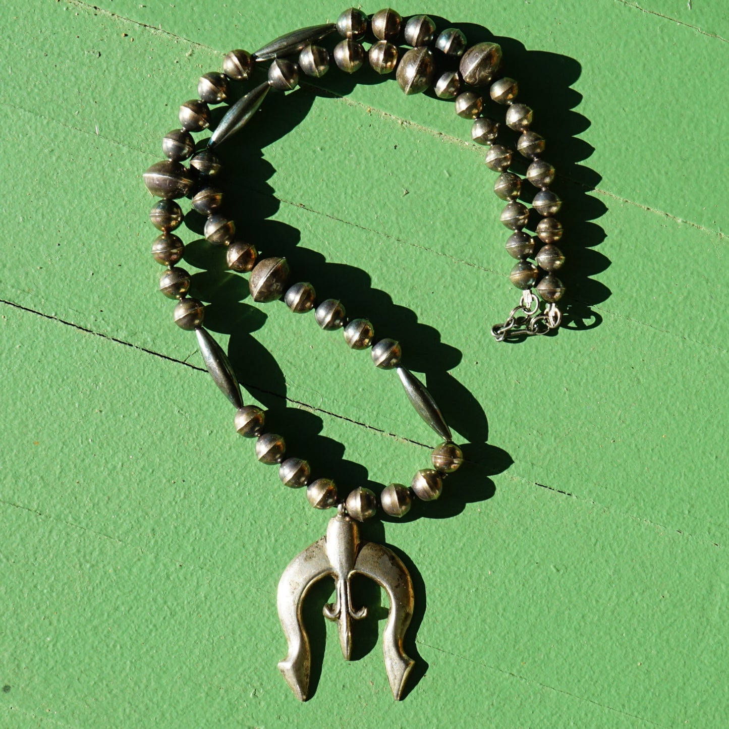 Vintage Sandcast Fleur De Lis Naja With Mercury Dime Bead Necklace