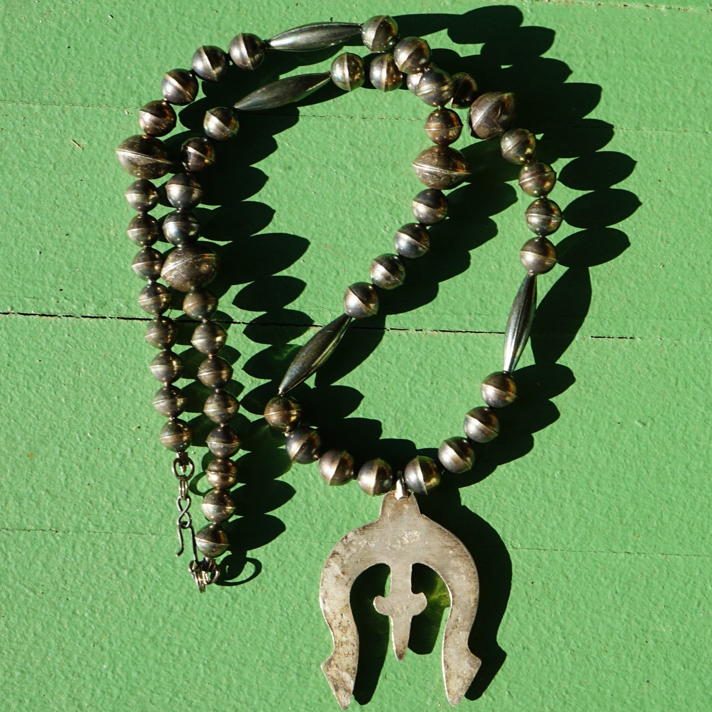 Vintage Sandcast Fleur De Lis Naja With Mercury Dime Bead Necklace