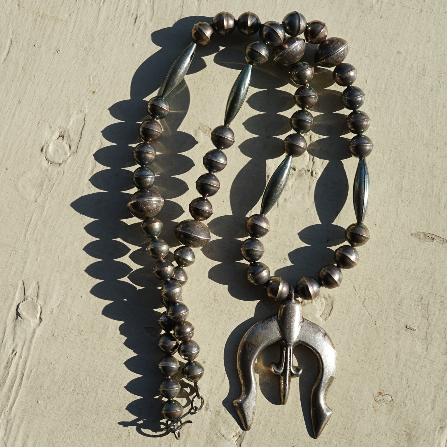 Vintage Sandcast Fleur De Lis Naja With Mercury Dime Bead Necklace